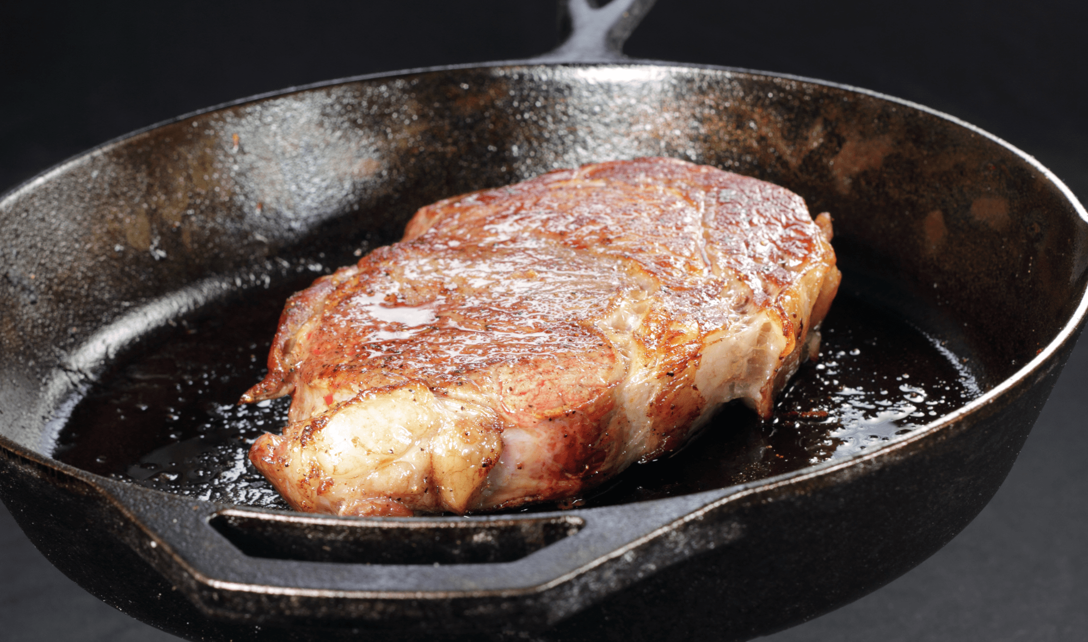 A steak in a cast iron pan.