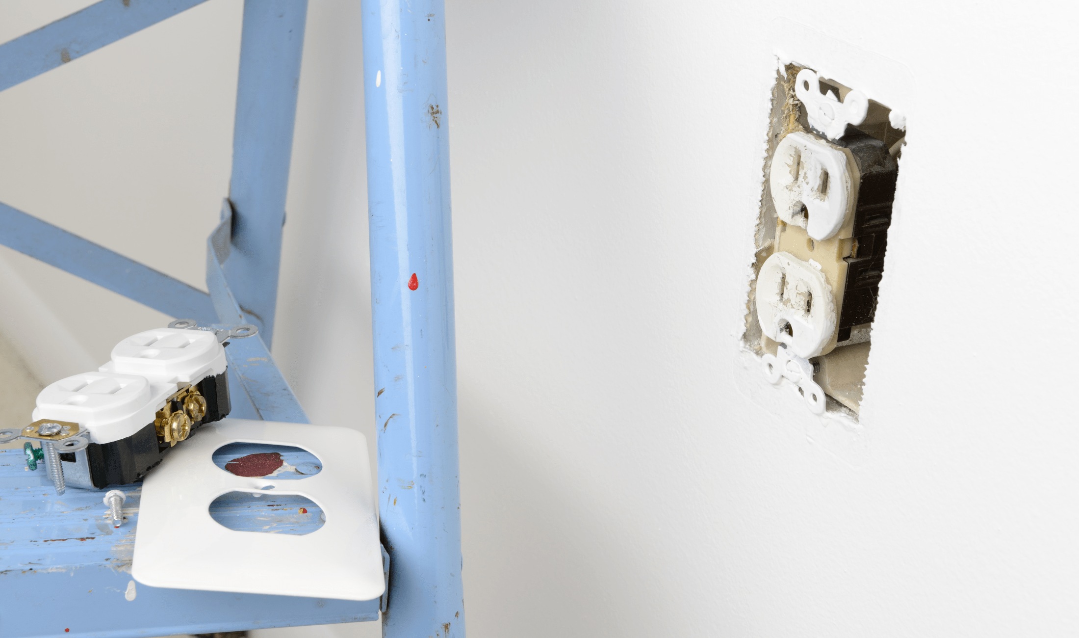 The mid-stage of replacing a wall outlet.