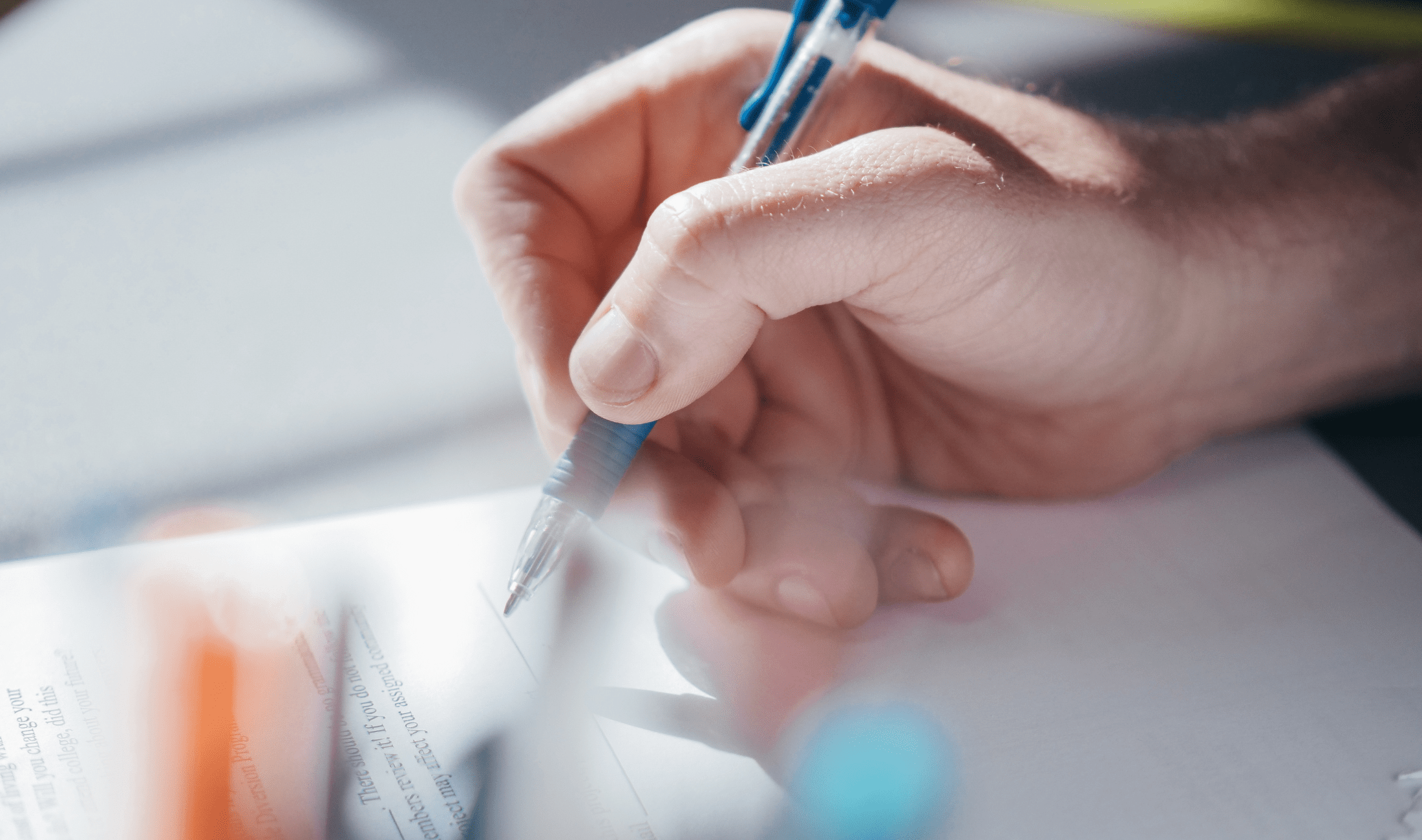 A person holding a pen.