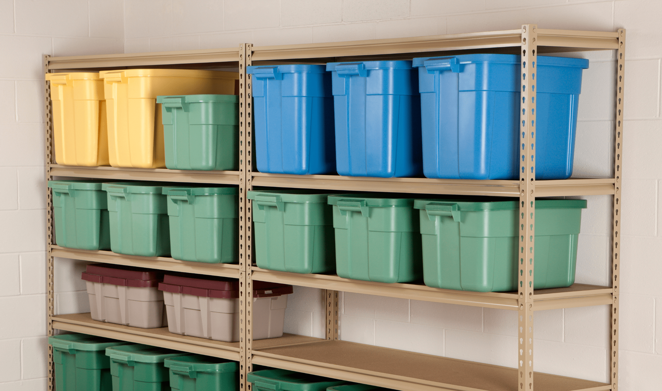 A storage rack in a garage full of plastic storage bins.