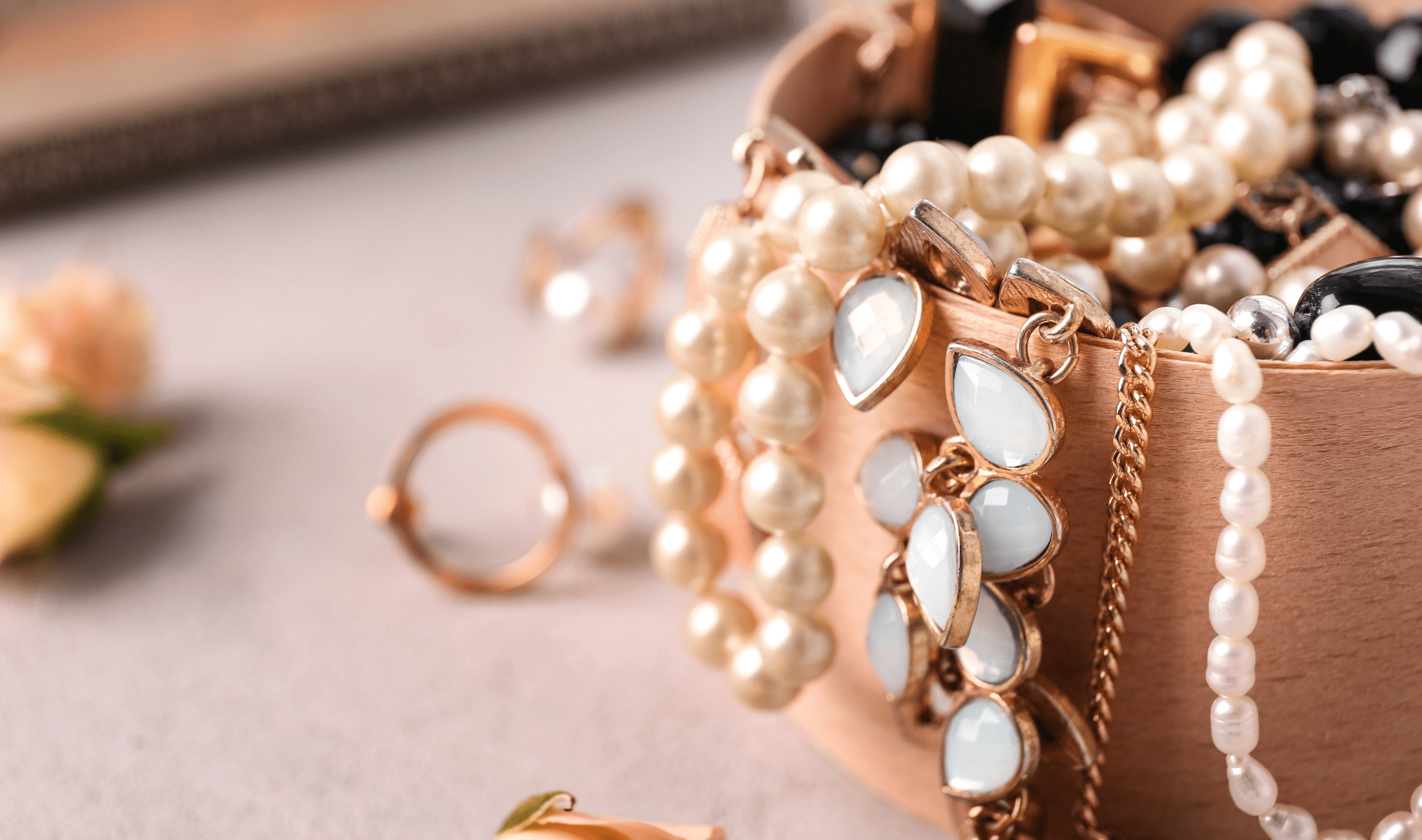A small container with necklaces in it.