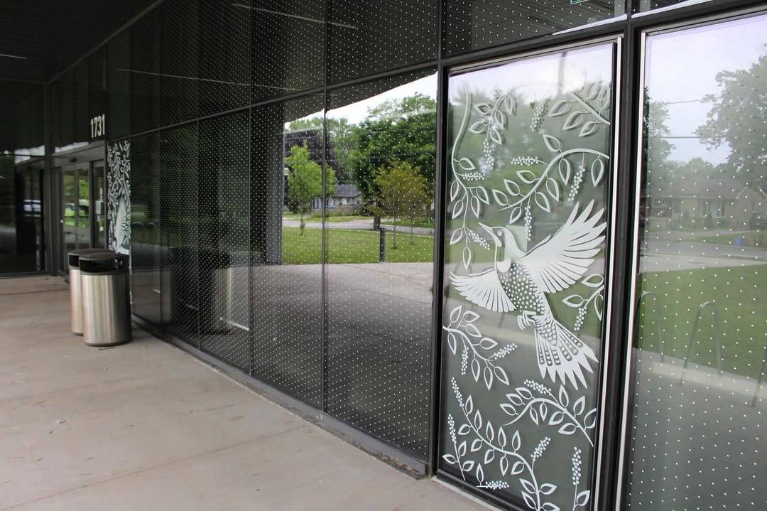 A photo of a city building from London, Ontario fitted with bird-safe window stickers.