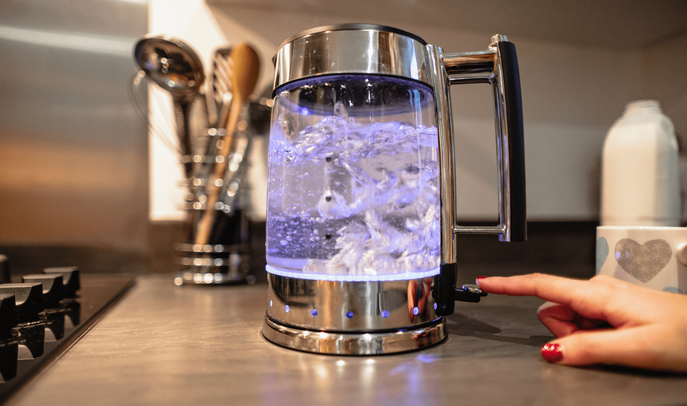A boiling transparent electric kettle.