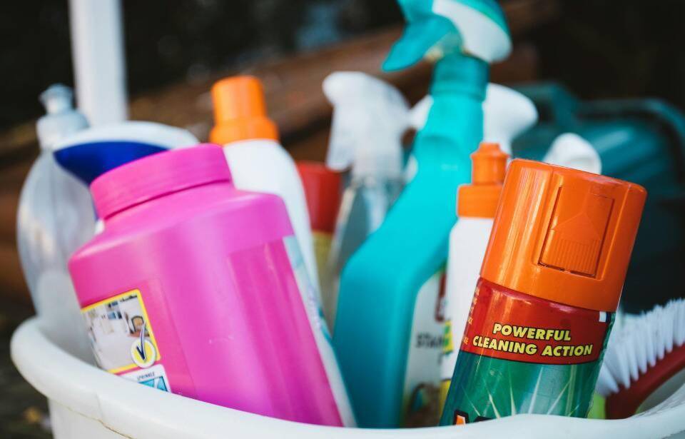 A bucket full of cleaning supplies.
