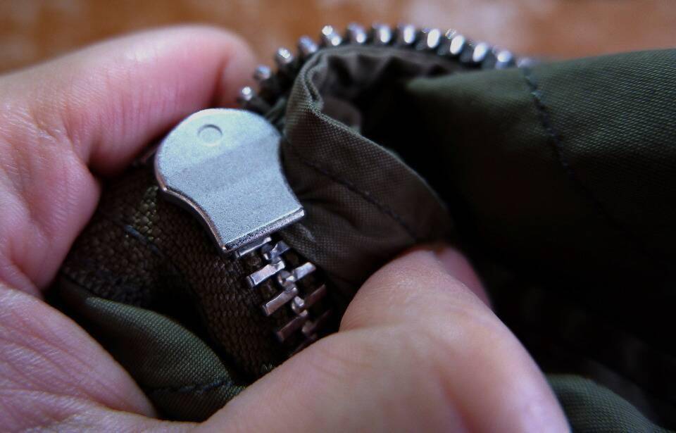 A closeup of a stuck zipper.