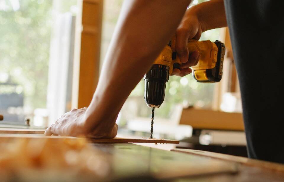 A man using a drill.
