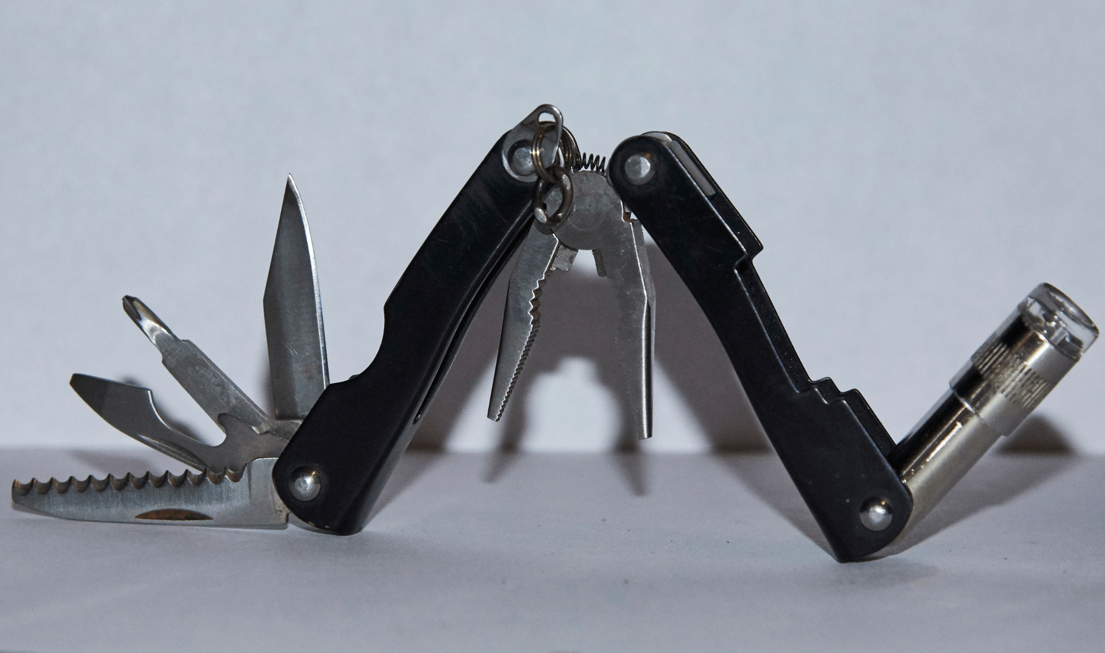 An open multi-tool, showing all the pieces inside.