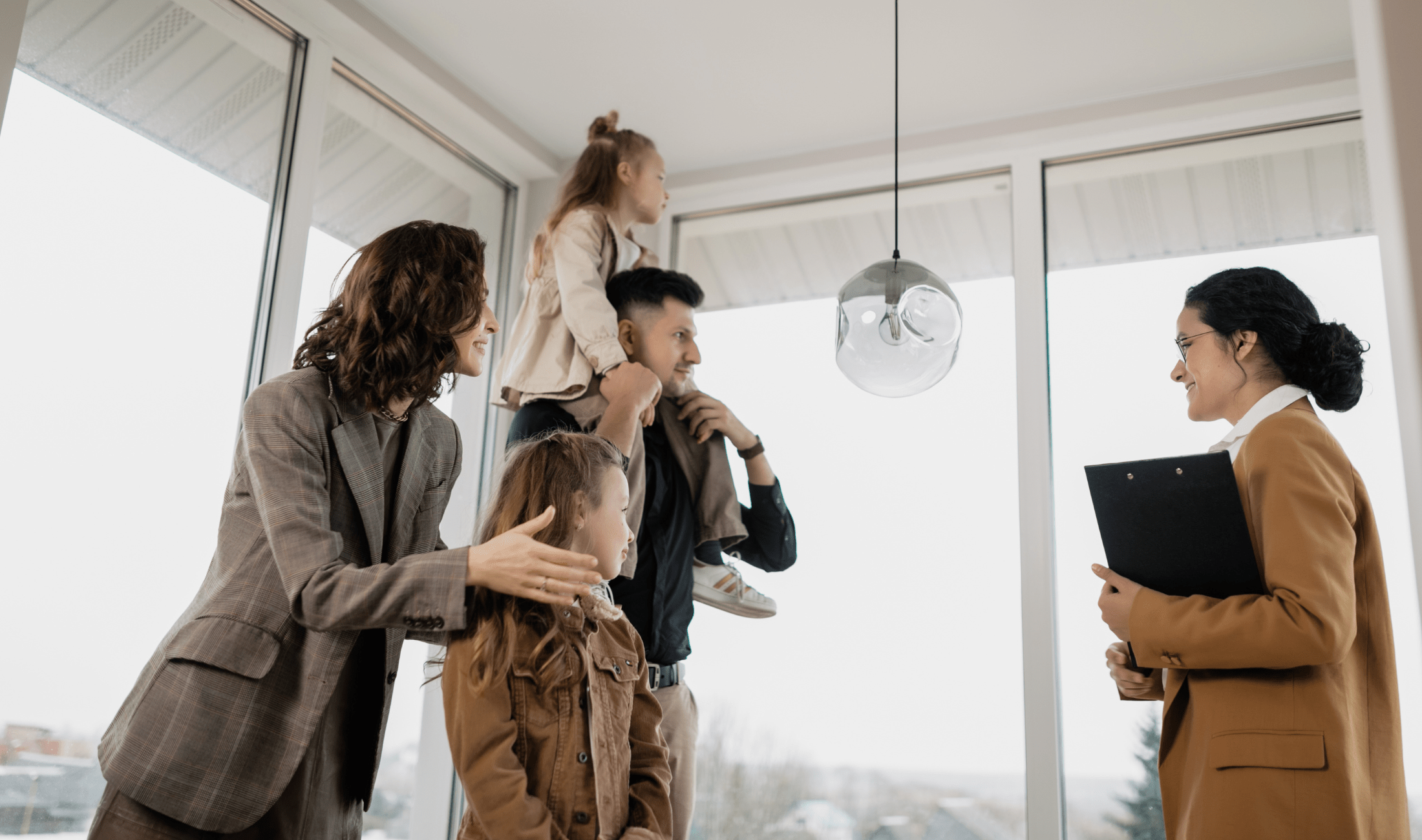 A realtor meeting a family, a couple with two young daughters, in an apartment.