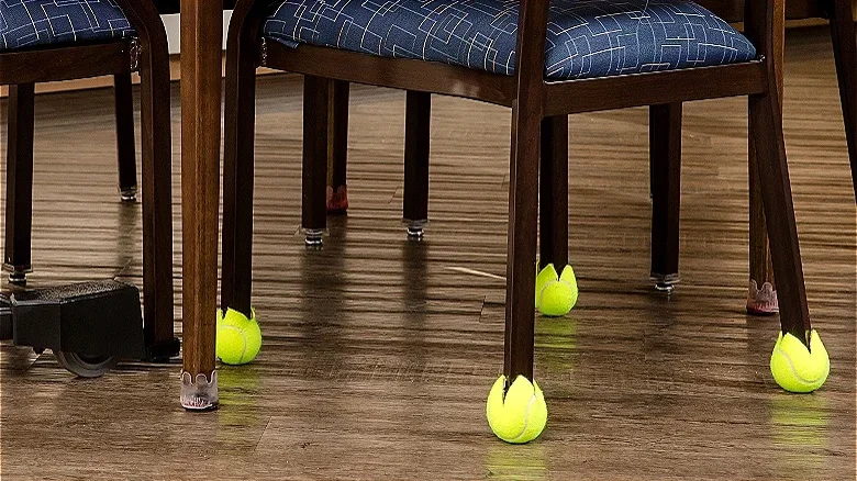 The lower part of some chairs with tennis balls on the end of every leg.