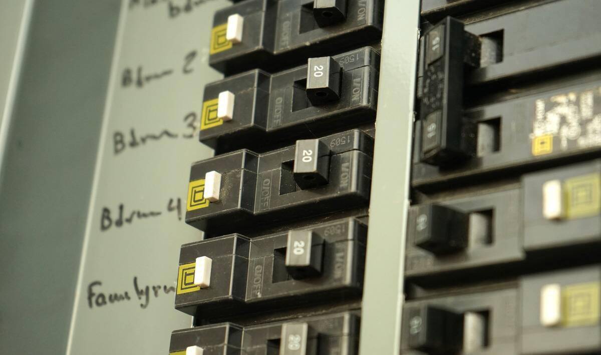A close photo of a home's breaker box, the switches labled.