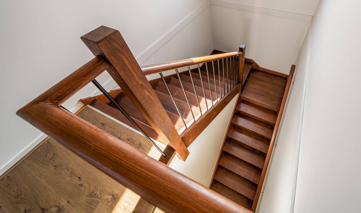 An above-angled shot of a home's wooden staircase.