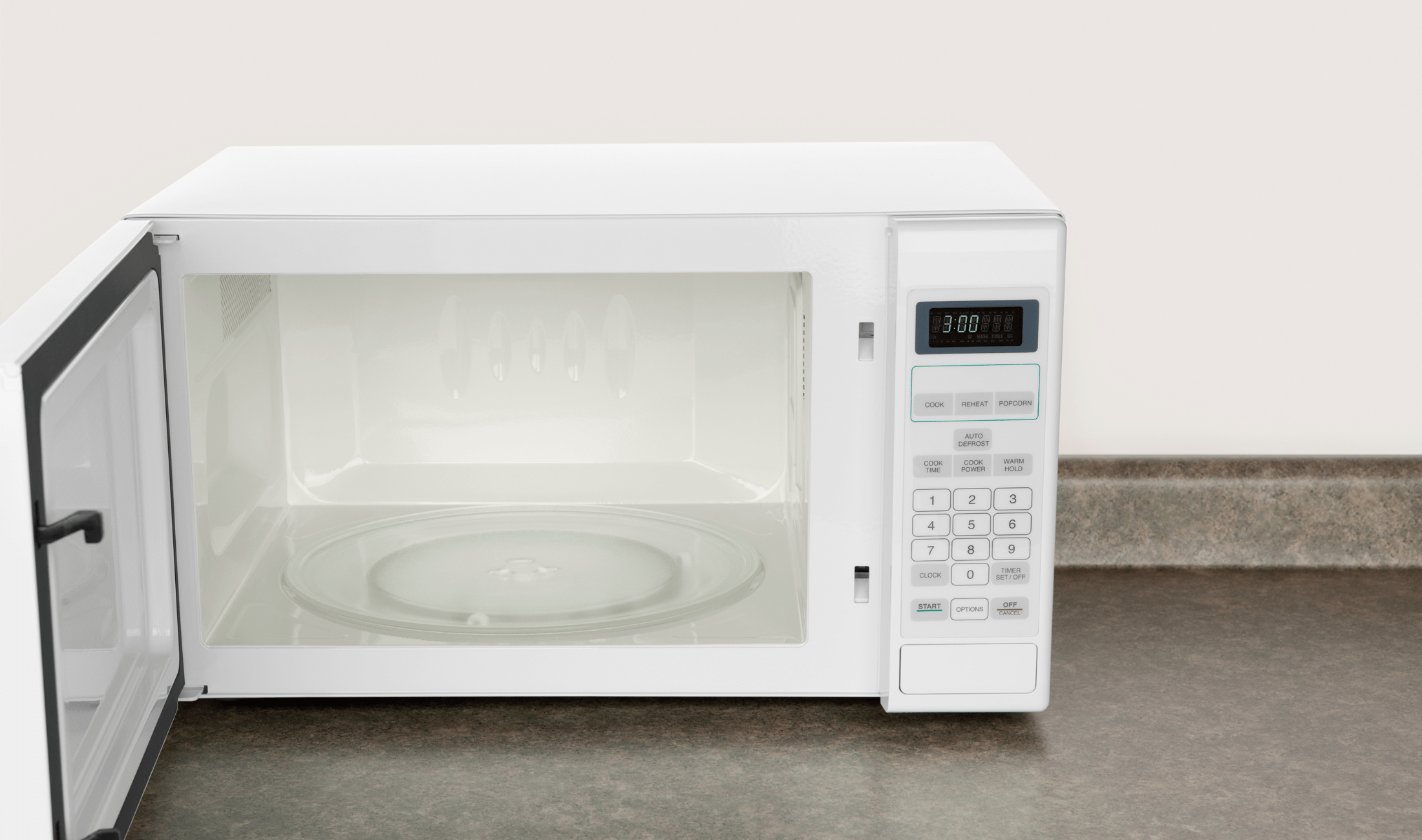 A clean white microwave with the door open on a kitchen counter.