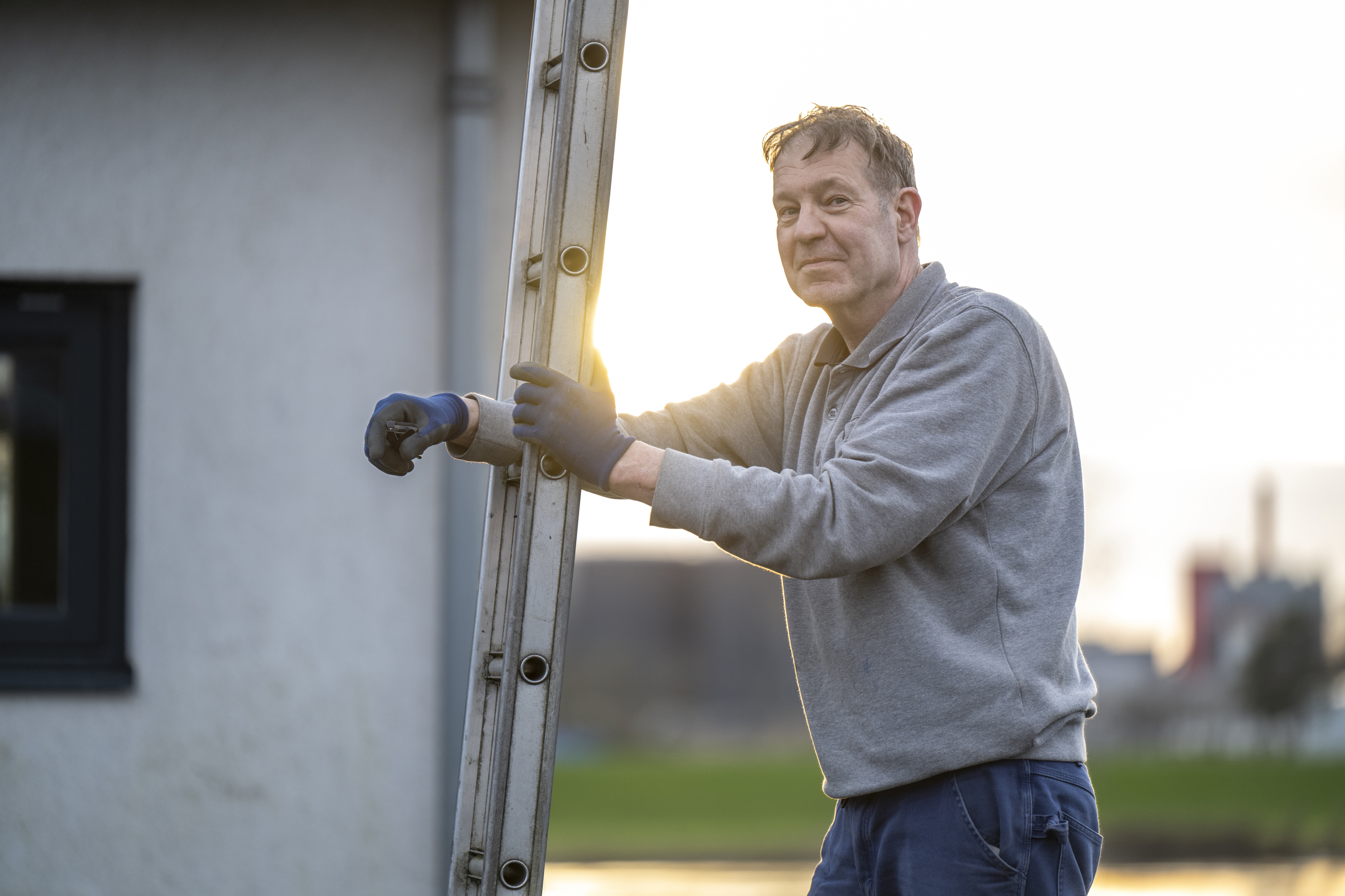 Man working outdoors at golden hour