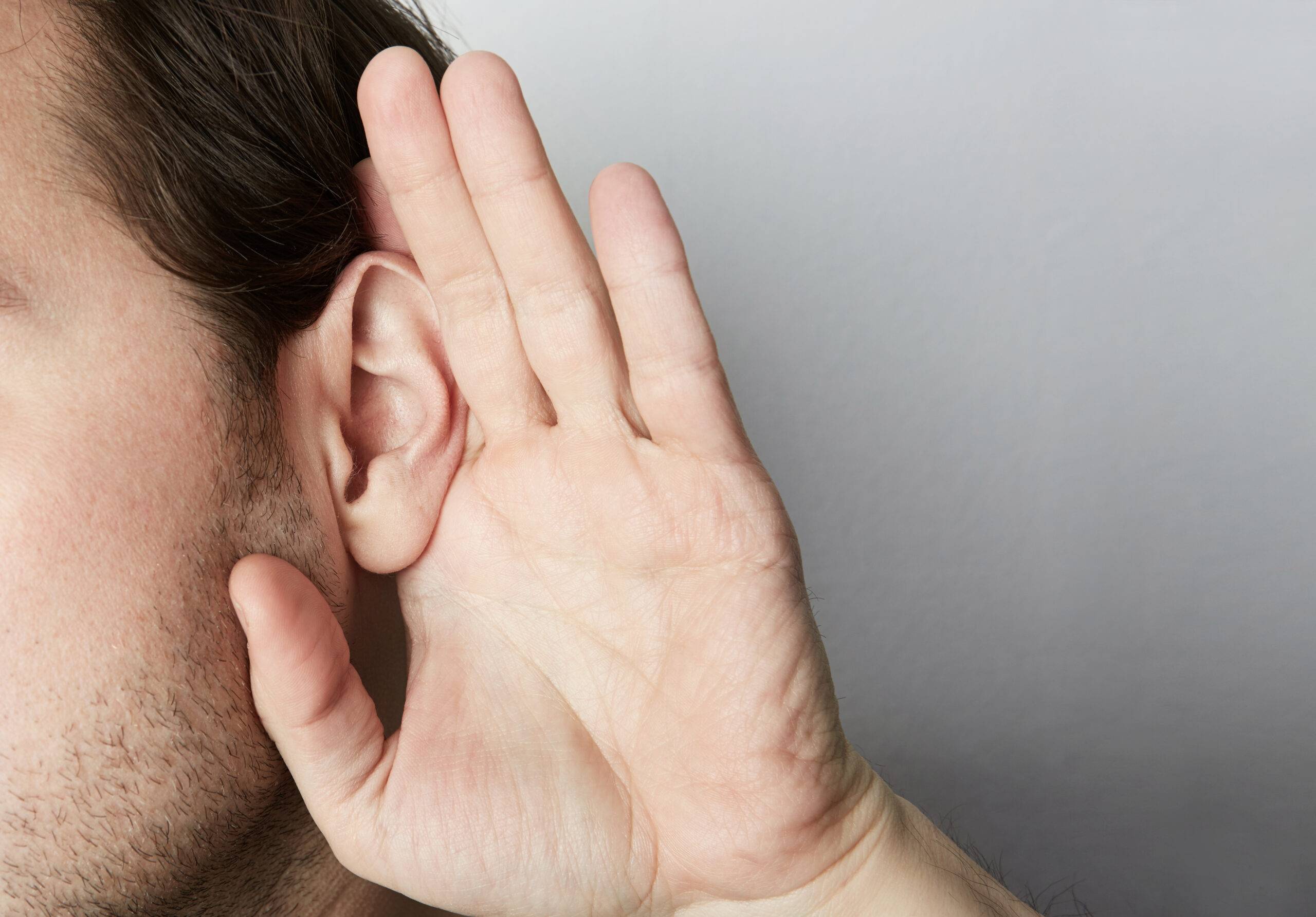 A man listening.