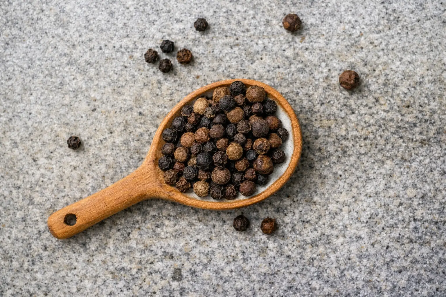 pepper in a wooden spoon