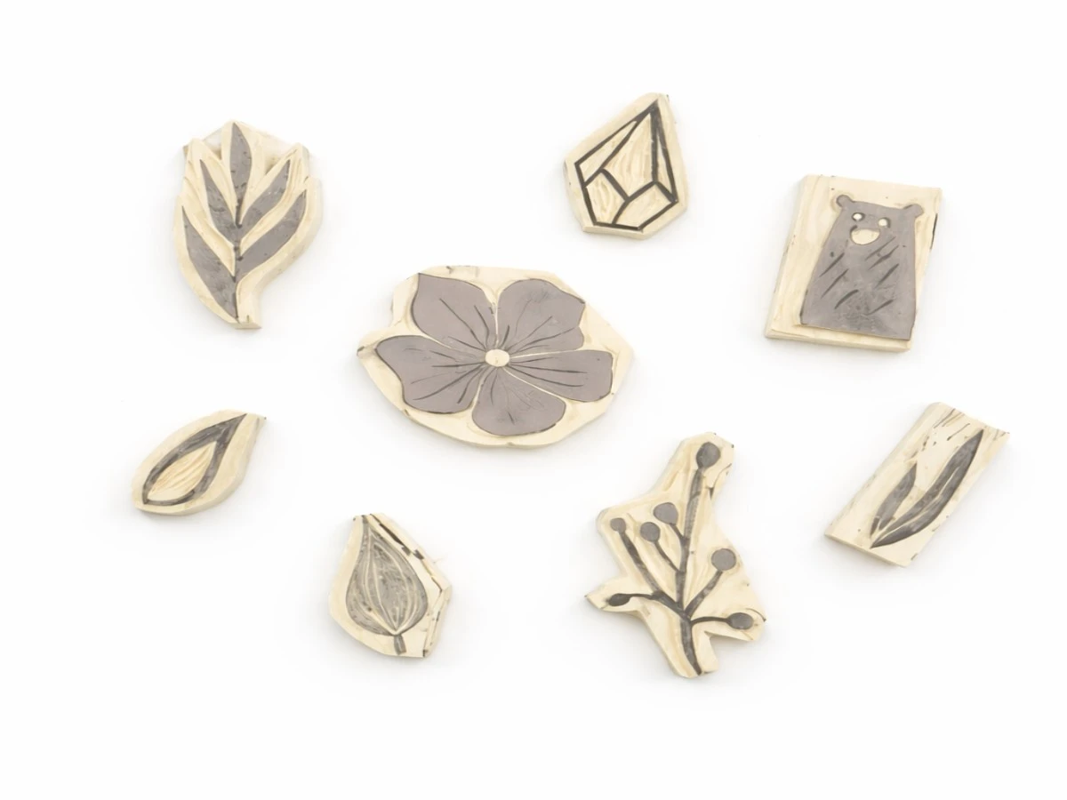 A few DIY hand carved signature stamps of leaves, flowers, a cat and a diamond.