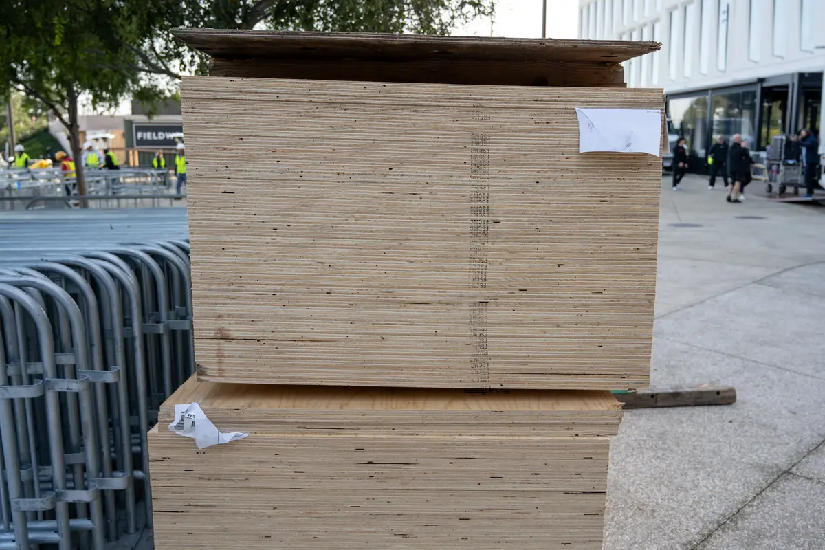 A shot of plywood piled in a construction site.