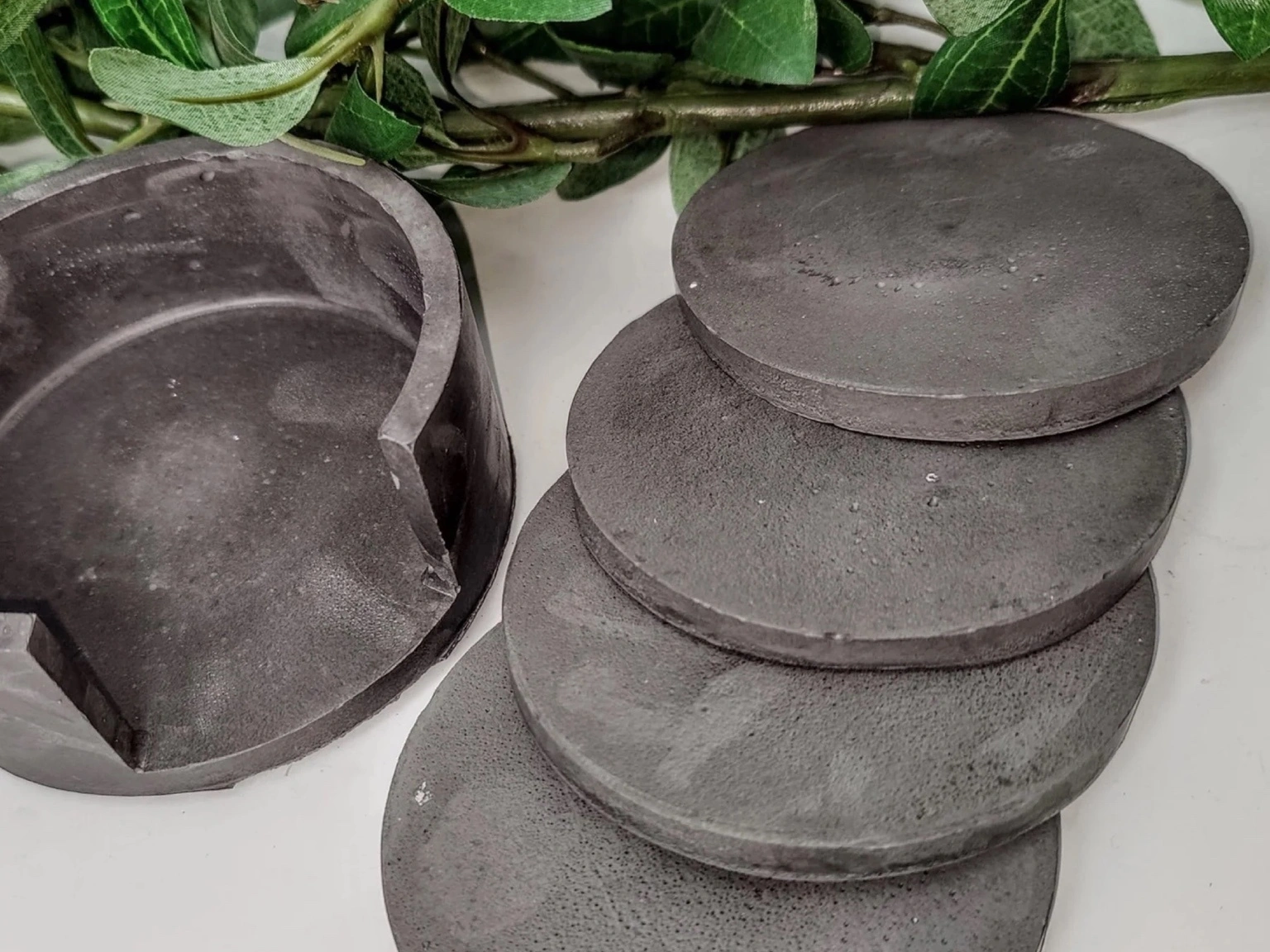 DIY Concrete coasters kept stacked on top of each other sliding sideways.