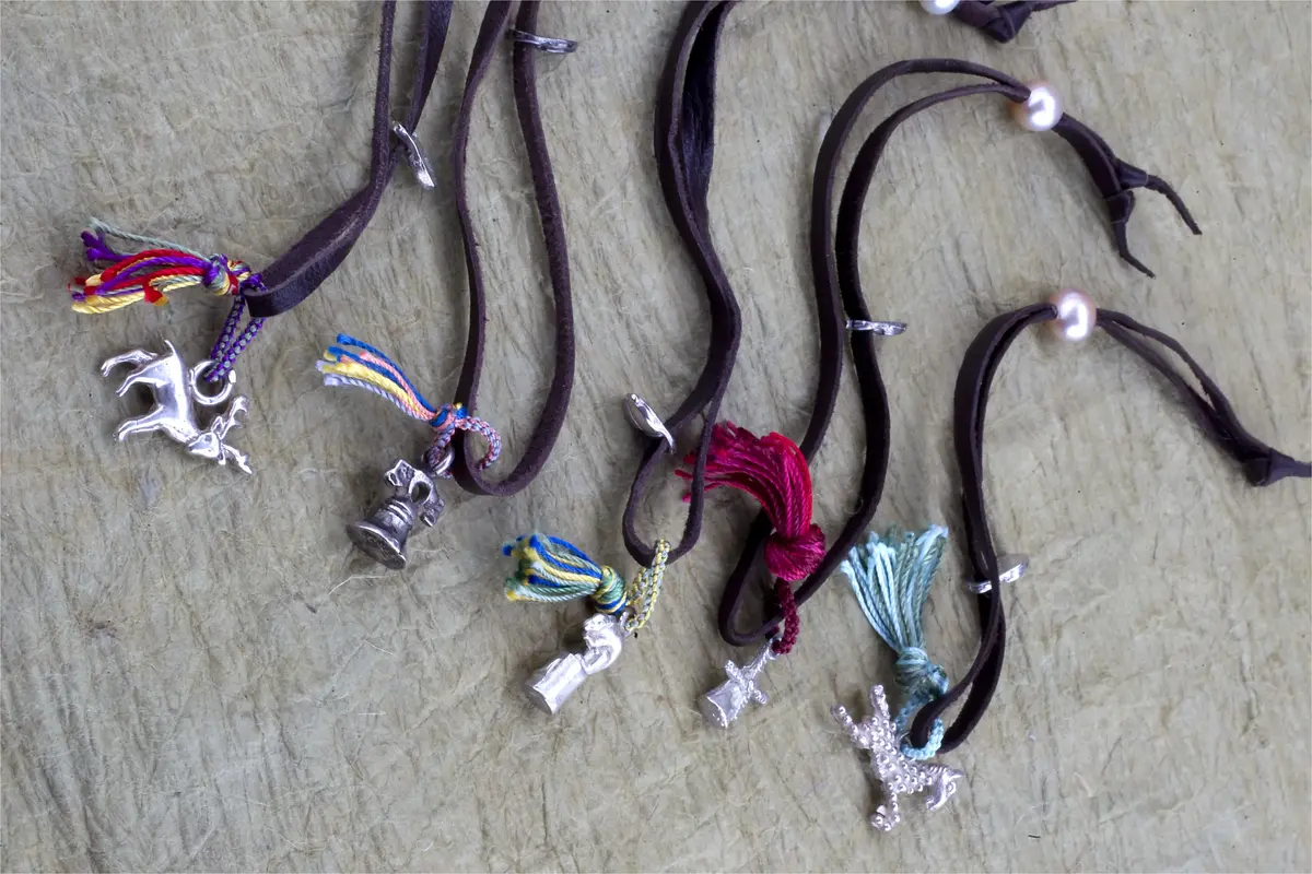Leather bracelets with silver charms