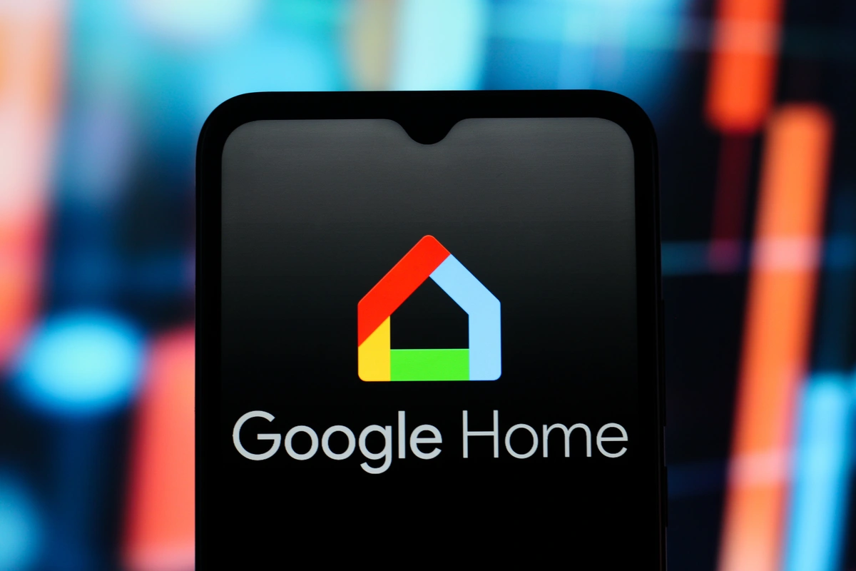 Google Home logo is seen displayed on a smartphone screen.